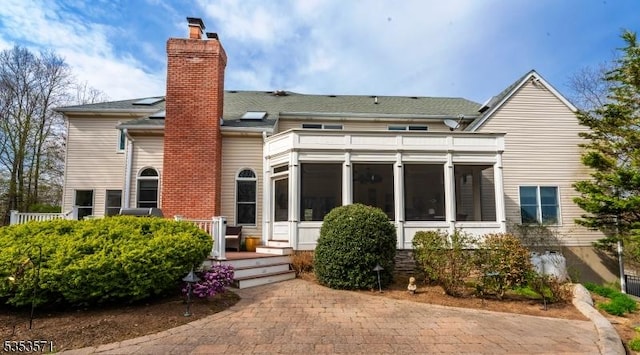 2 Natale Dr, Sparta Twp, NJ 07871 - back of house featuring a sunroom and a chimney