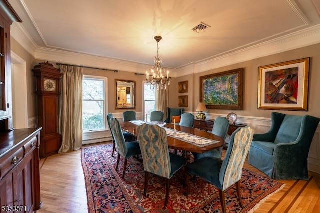 2 Natale Dr, Sparta Twp, NJ 07871 - dining area featuring ornamental molding, light wood-type flooring, and a chandelier