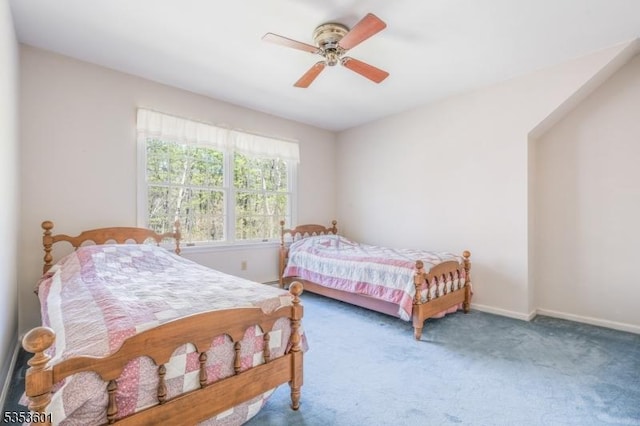 bedroom featuring baseboards, carpet flooring, and a ceiling fan