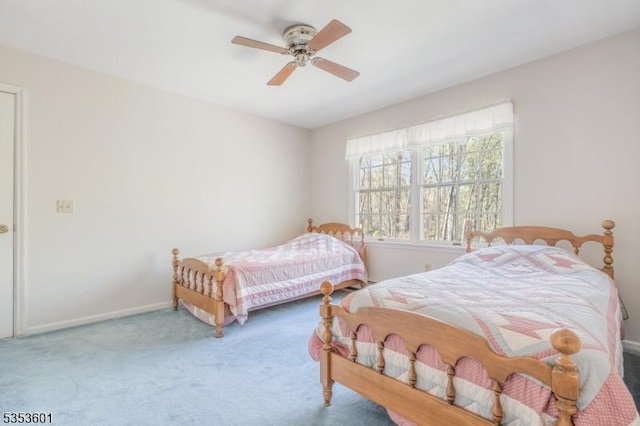bedroom with carpet floors, baseboards, and ceiling fan