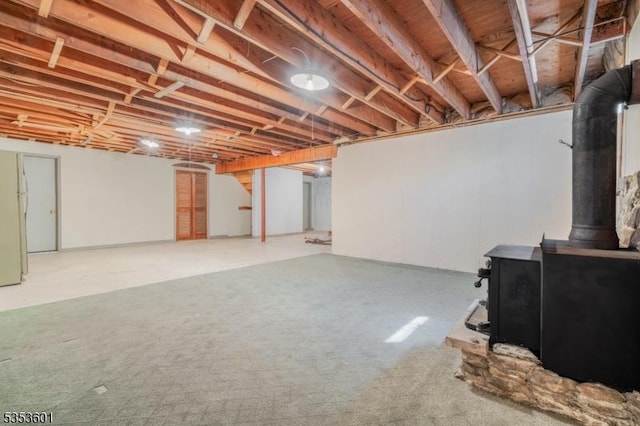basement featuring a wood stove