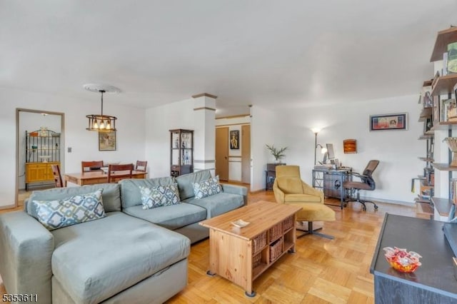 living area featuring a chandelier