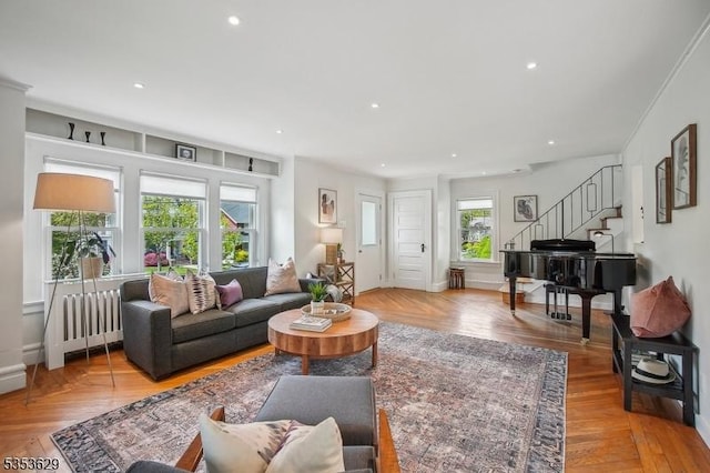 living room with stairs, recessed lighting, baseboards, and radiator heating unit