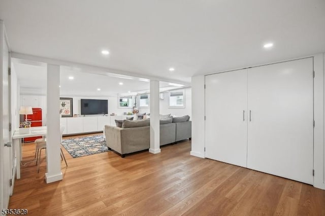 living room featuring recessed lighting and light wood-style flooring