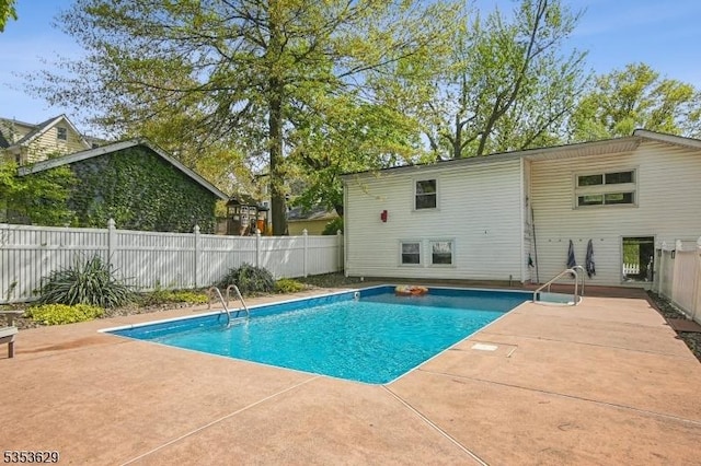 view of pool with a fenced in pool, a fenced backyard, and a patio area