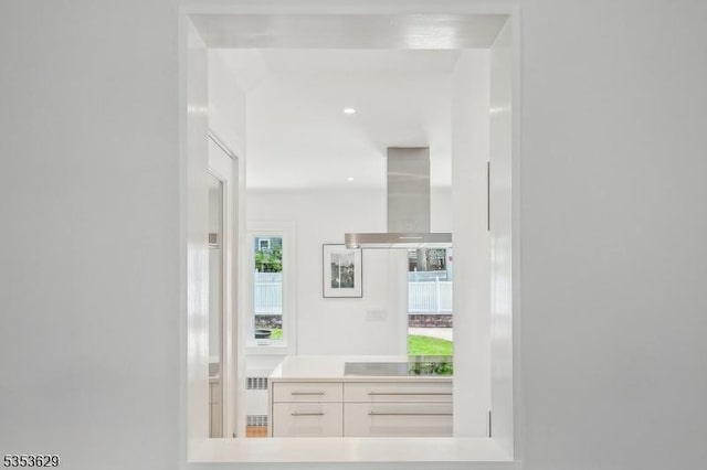 interior space featuring radiator and recessed lighting