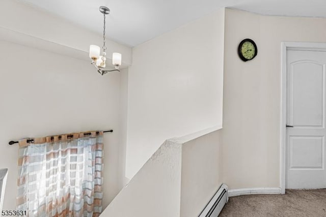 interior space with an inviting chandelier and carpet flooring