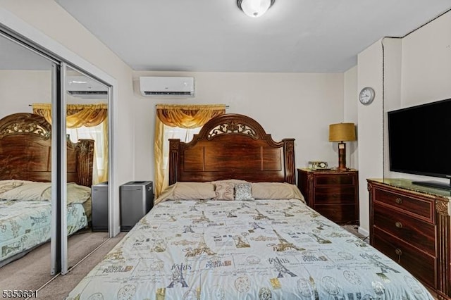 bedroom featuring carpet floors, a closet, and an AC wall unit