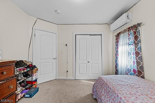 carpeted bedroom with an AC wall unit and a closet
