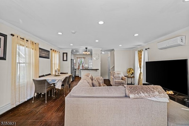 living area featuring ornamental molding, recessed lighting, an AC wall unit, and dark wood finished floors