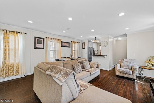 living area with recessed lighting, a notable chandelier, crown molding, baseboards, and dark wood finished floors