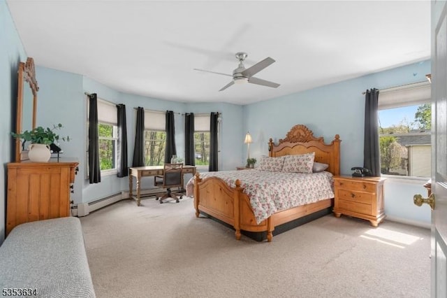 bedroom with baseboard heating, ceiling fan, and light carpet