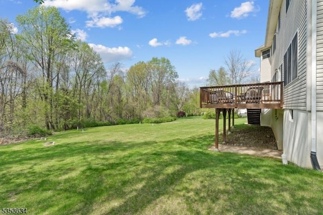 view of yard with a wooden deck