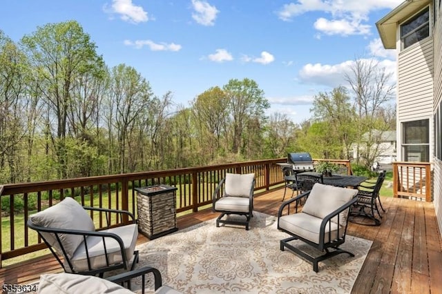 wooden deck featuring outdoor dining space