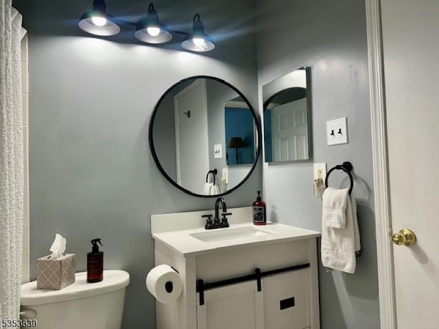 bathroom with vanity and toilet