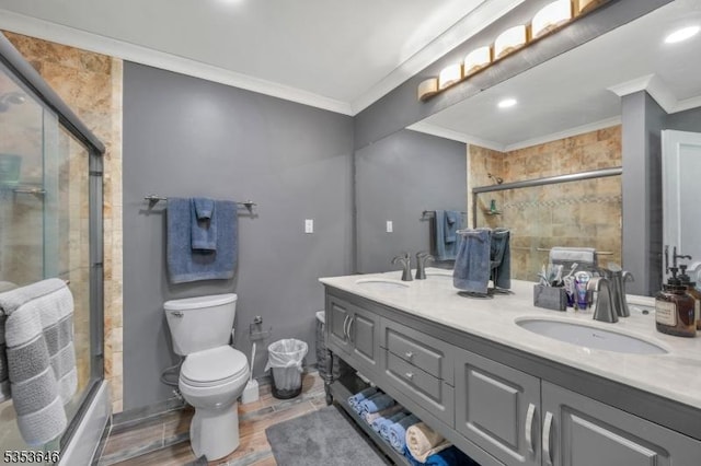 50 Perryville Rd, Union Twp, NJ 08867 - bathroom featuring crown molding, toilet, tiled shower, and a sink