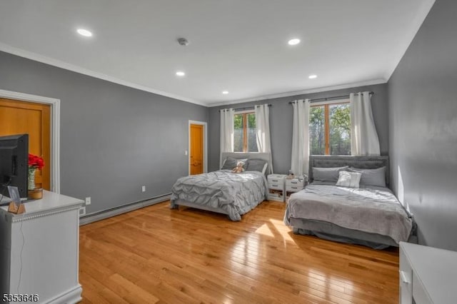 50 Perryville Rd, Union Twp, NJ 08867 - bedroom featuring crown molding, recessed lighting, light wood-style floors, and a baseboard heating unit