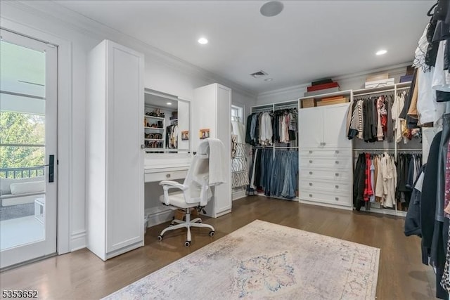 walk in closet with wood finished floors and visible vents