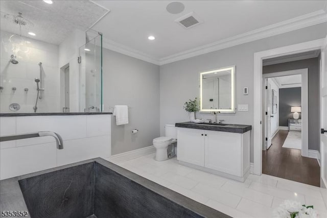 bathroom featuring vanity, ornamental molding, toilet, walk in shower, and recessed lighting