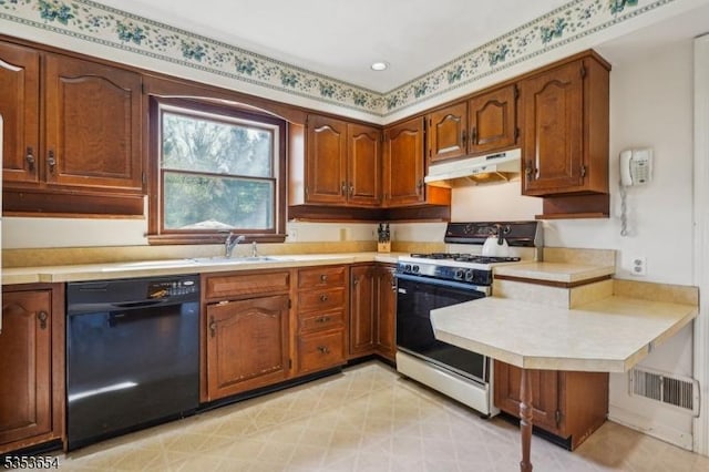 kitchen featuring a sink, light countertops, black dishwasher, under cabinet range hood, and range with gas cooktop