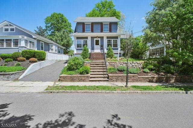 view of front of home with stairs