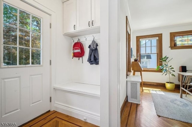 mudroom featuring wood finished floors and baseboards