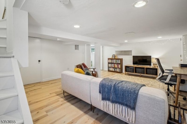 living room featuring wood finished floors and recessed lighting