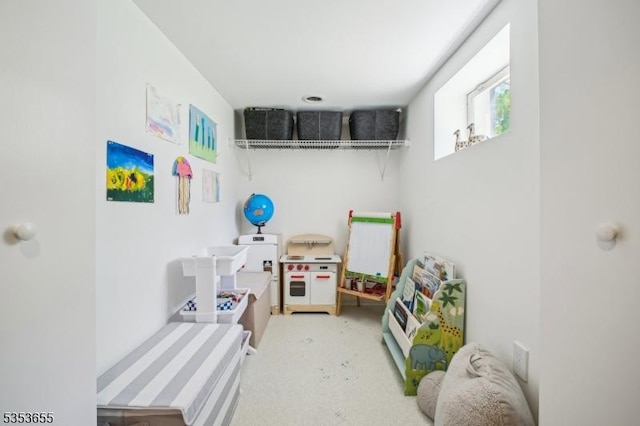 rec room featuring carpet flooring