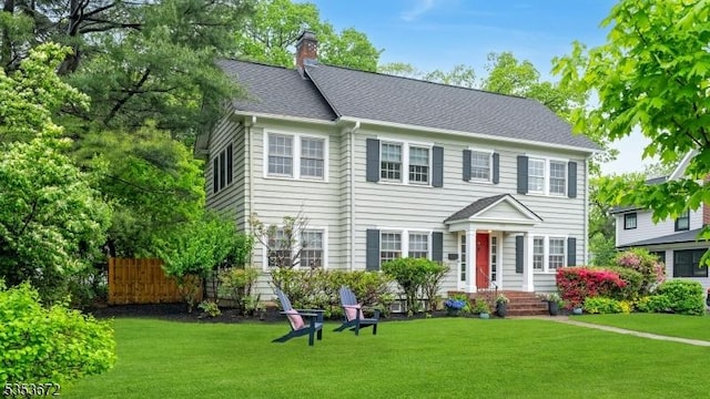 colonial-style house with a chimney