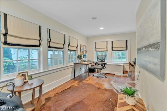 office area with radiator, wood finished floors, crown molding, and recessed lighting