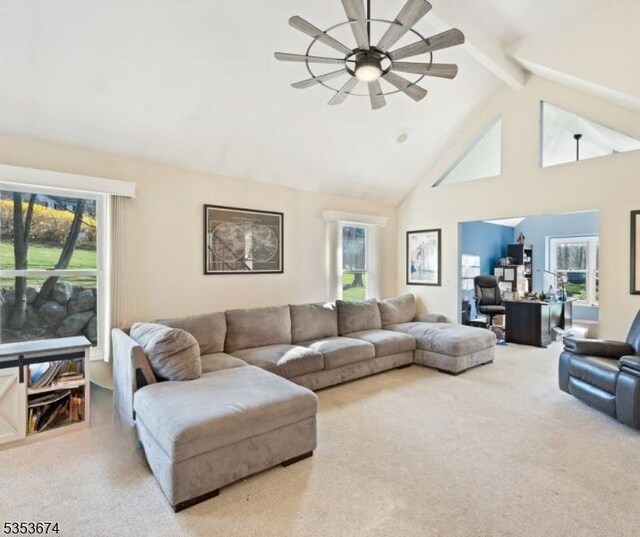 living room with carpet floors, ceiling fan, a healthy amount of sunlight, and high vaulted ceiling