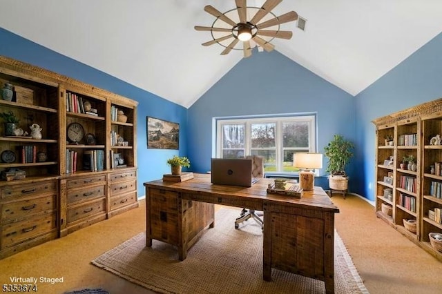 home office with a ceiling fan, light carpet, and lofted ceiling