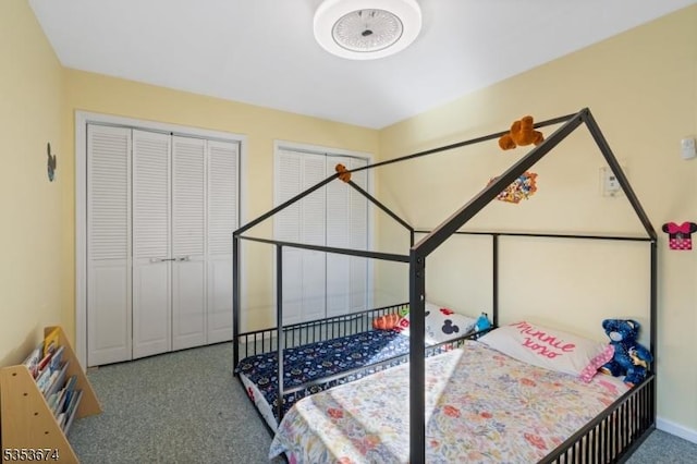 bedroom featuring carpet floors and baseboards