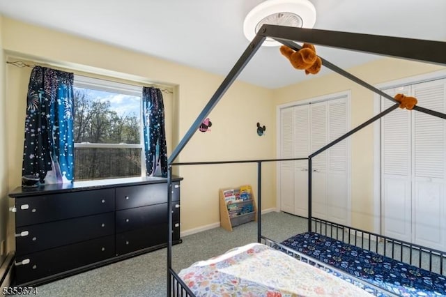 bedroom featuring baseboards, ceiling fan, and carpet