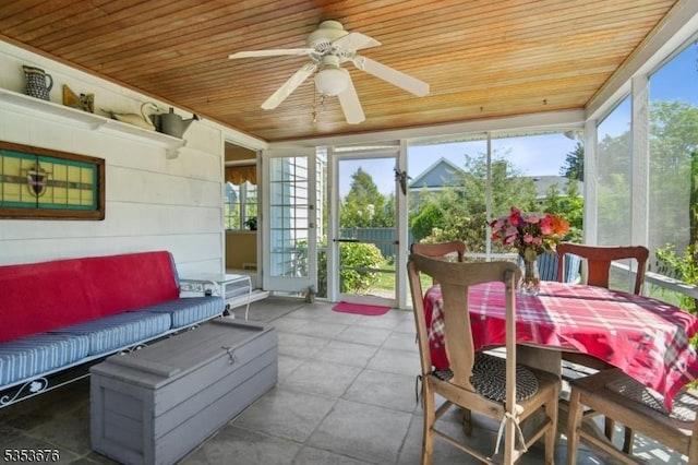 sunroom / solarium with outdoor dining area, a ceiling fan, and outdoor lounge area