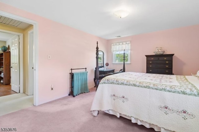 bedroom with light carpet