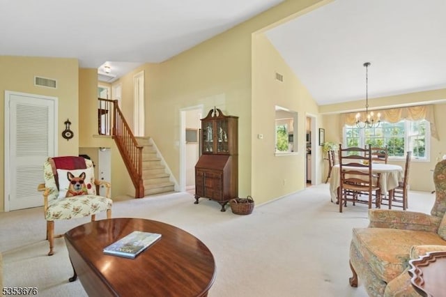 living area with an inviting chandelier, carpet floors, and visible vents