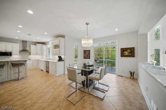 dining room featuring visible vents, light tile patterned floors, baseboards, a chandelier, and recessed lighting