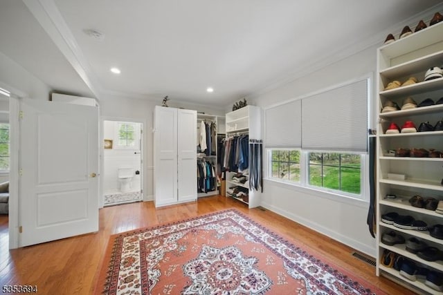 walk in closet with visible vents and light wood-style flooring