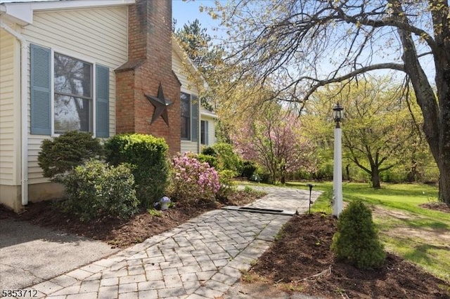 view of side of property with a chimney