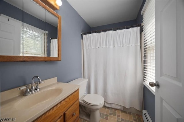 bathroom with a baseboard heating unit, toilet, vanity, and curtained shower