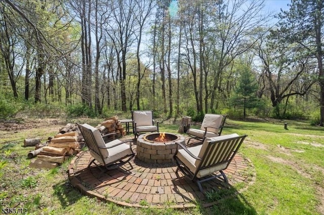 view of patio / terrace with an outdoor fire pit