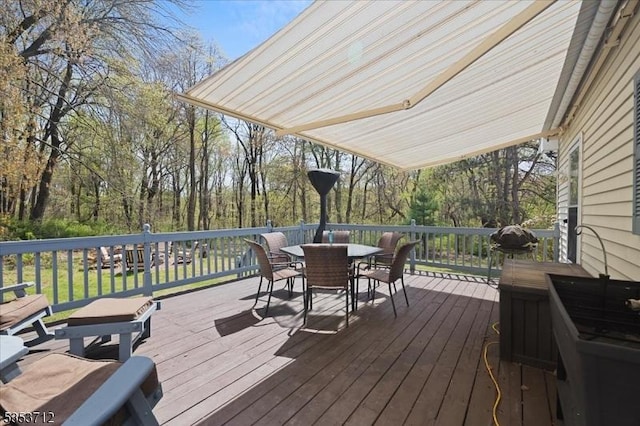 deck featuring outdoor dining area