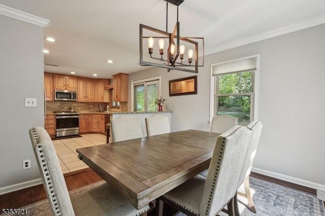 dining space with recessed lighting, a healthy amount of sunlight, and light wood-style floors