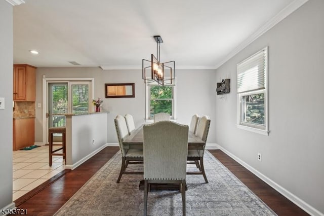dining room with recessed lighting, an inviting chandelier, baseboards, and dark wood-style floors
