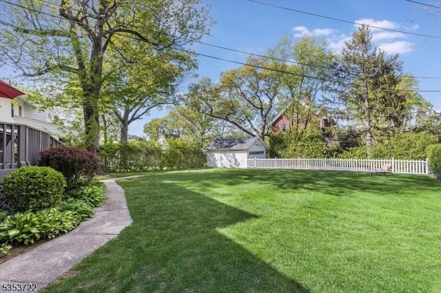 view of yard with an outdoor structure and a storage shed
