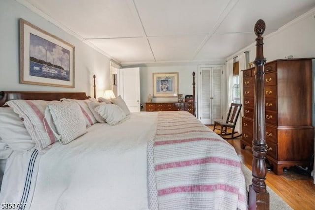 bedroom featuring wood finished floors and a closet