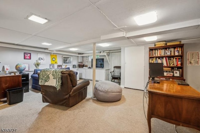 living area with carpet flooring and an office area