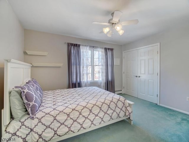 carpeted bedroom with baseboards, a ceiling fan, a closet, and a baseboard heating unit