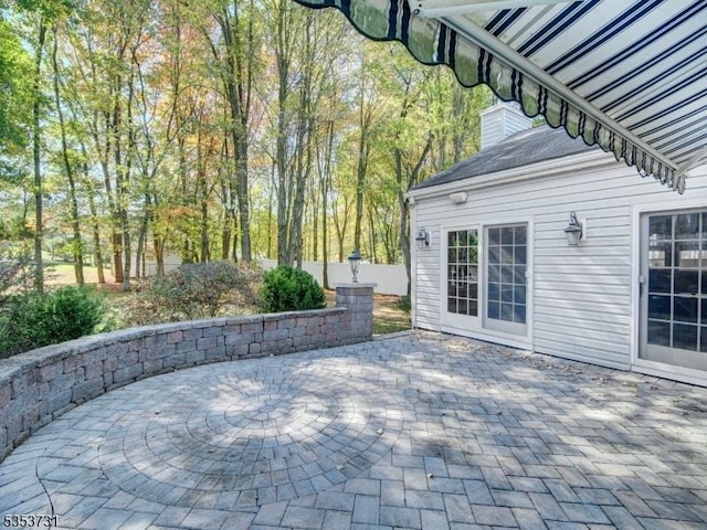 view of patio featuring fence